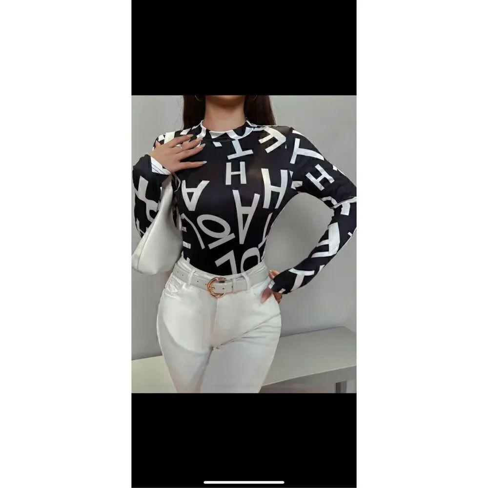 Beautiful, black and white Letter print, mock casual long sleeve blouse .By univ